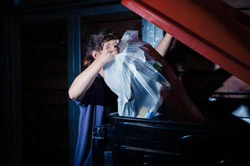 Professional workers efficiently clearing items from a house