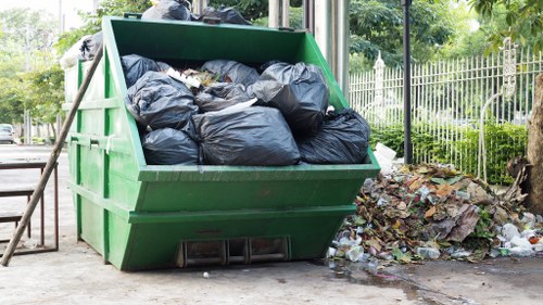 Team of professionals handling rubbish removal